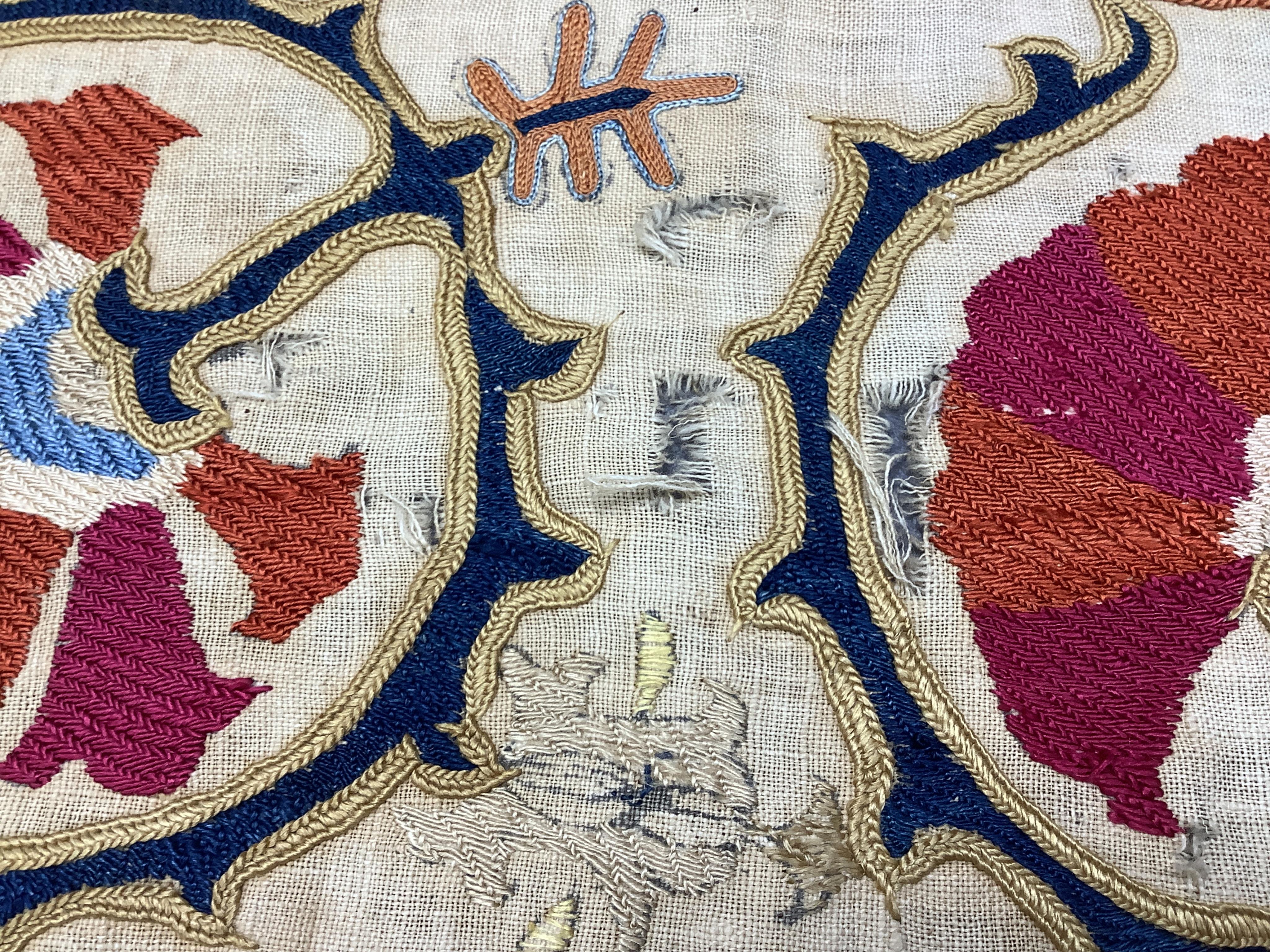 A 19th century Uzbekistan Suzani, hand embroidered hanging. Made from hand woven linen panels each approximately 28cm wide x 167cm long. Hand embroidered with silk hand dyed threads, in orange, red, blue and yellows, usi